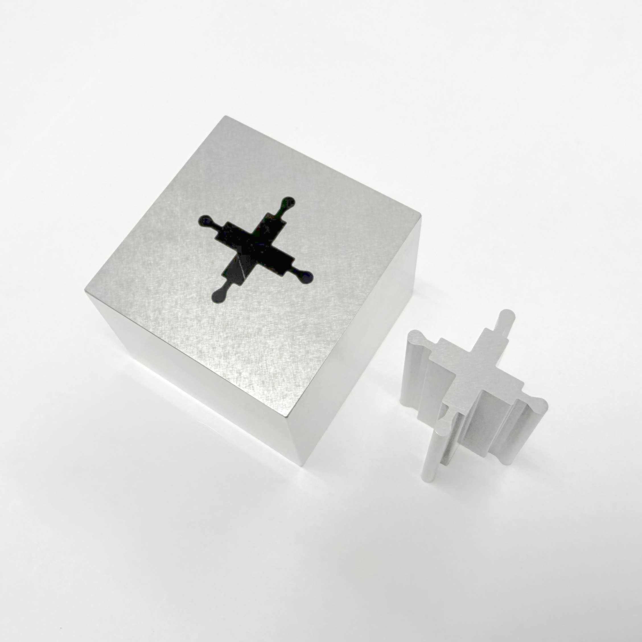 Two parts that were cut from a Wire EDM process.